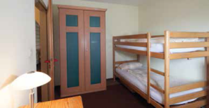 Room with bunk bed and cupboard