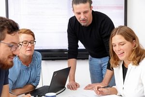 People around a desk