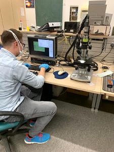 Man in front of a computer.