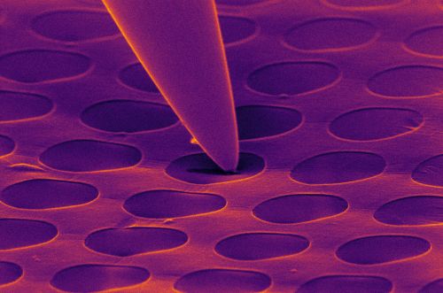Small metal tip used for cleaning of surfaces on the nanoscale