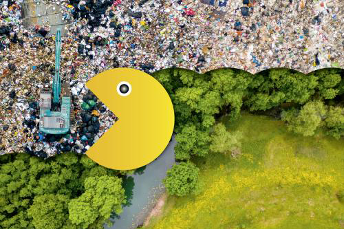 Ein Pacman, der Müll frisst. Dahinter kommt grüne Natur zum Vorschein.