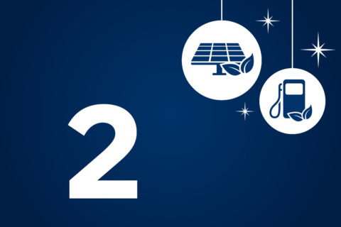 Auf blauem Hintergrund steht in weiß die Zahl 2 sowie Grafiken von einer Solaranlage und einer Tankstelle.