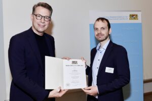 Dr.-Ing. Marcel Bartz from the Department of Mechanical Engineering at Friedrich-Alexander-Universität Erlangen Nürnberg and Minister of Science Markus Blume