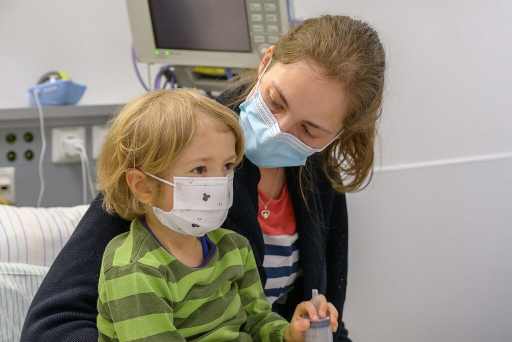 Mother and son wearing protective masks.
