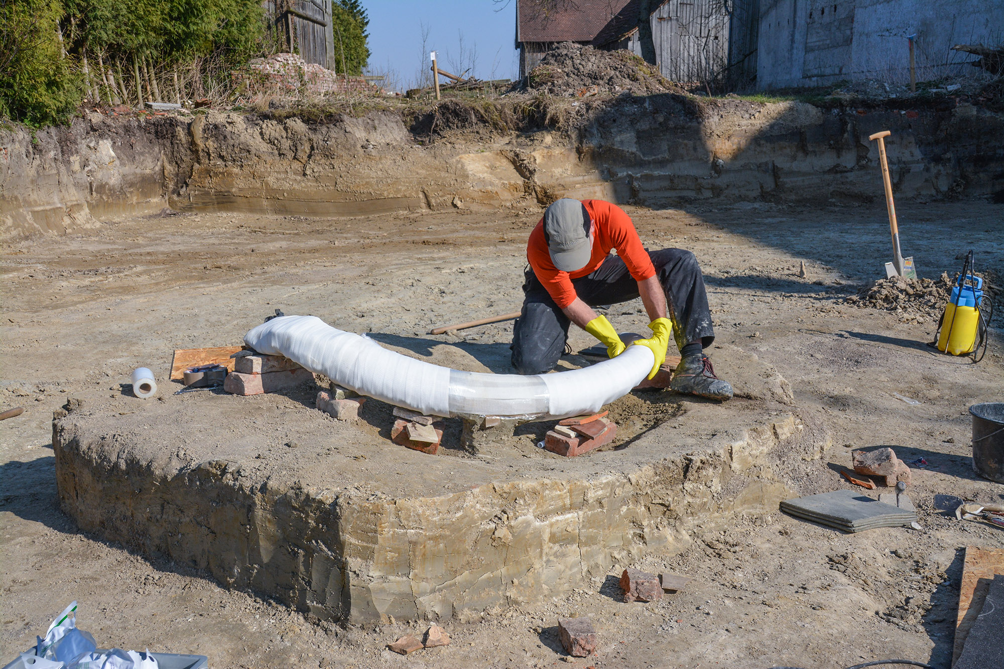 A Bavarian State Office for the Preservation of Historical Monuments employee recovering the mammoth tusk.